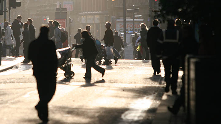 A crowded crossing in Manchester city centre.