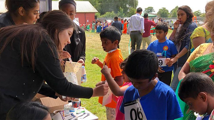 Children receiving dental care products as part of the Tamil project.