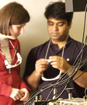 Two people in discussion in a lab.