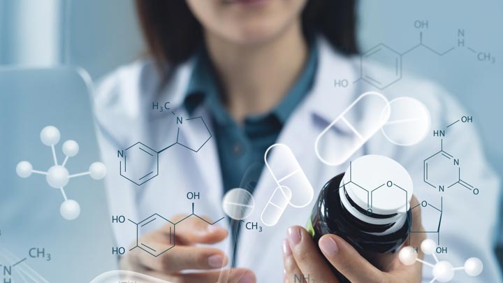 Medical student looking at medication.