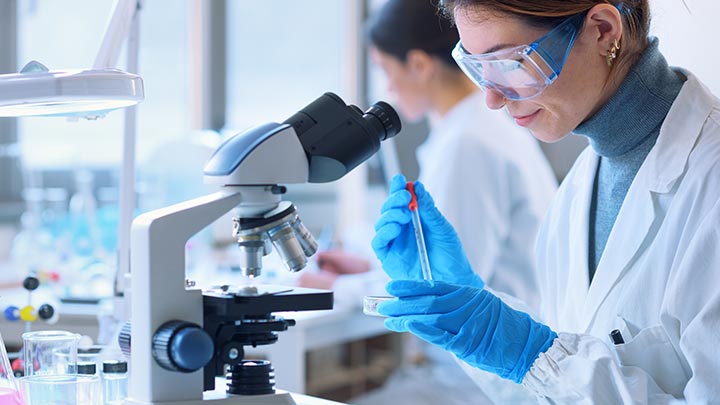 Medical student looking at equipment.