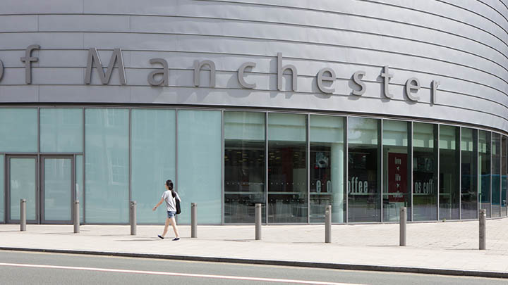 A student walking outside of University Place.