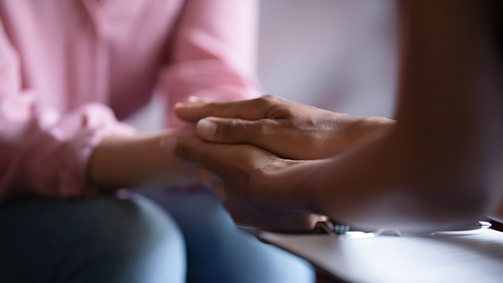 Closeup of holding hands