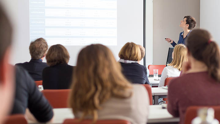 A member of staff giving a presentation during a workshop.