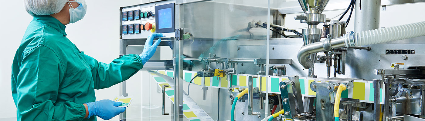 pharmaceutical factory woman worker operating production line at pharmacy industry manufacture factory 
