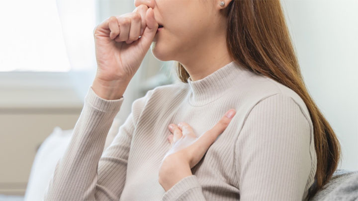 A woman coughing