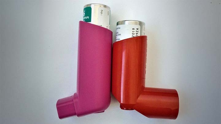 A red and a pink inhaler