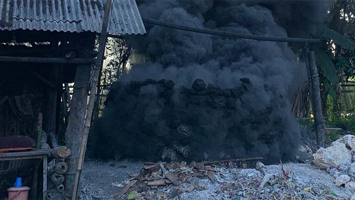 Plastics being burned in a village in Indonesia