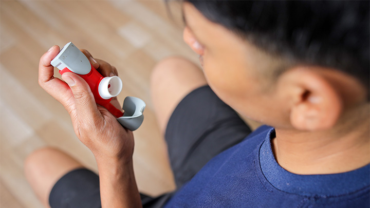 Person using an inhaler