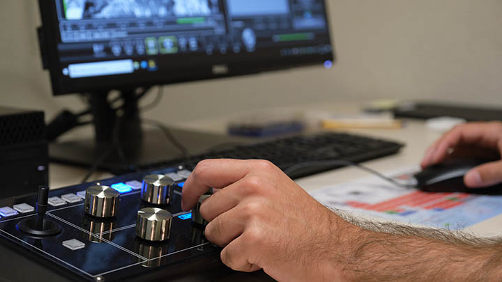 Laboratory technician observing samples with a SEM.