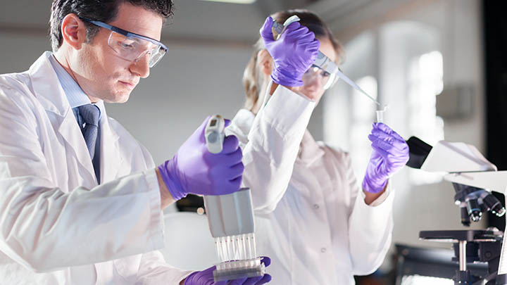 Researchers preparing samples in the lab.