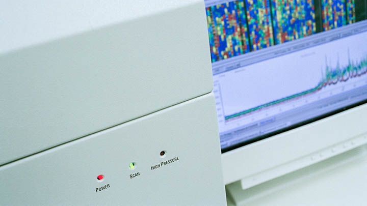 DNA sequencing readout on genetic mapping equipment in the lab.