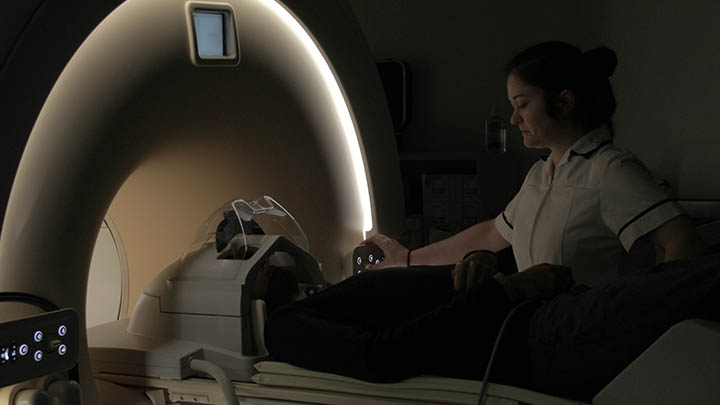 A radiographer giving a patient a scan.