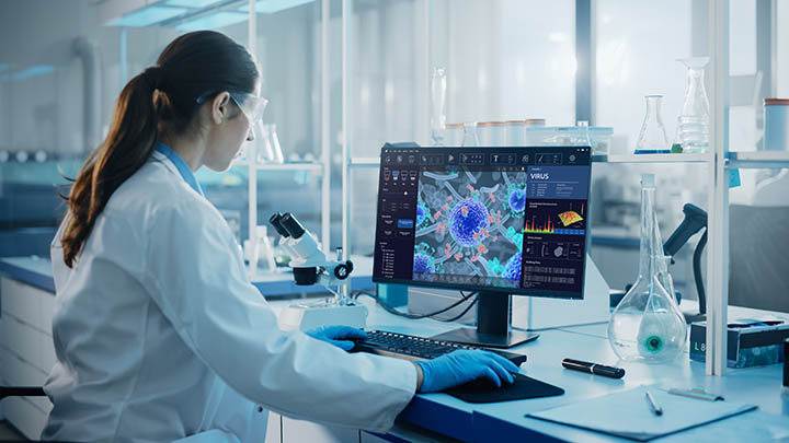 A researcher using a computer in the lab.