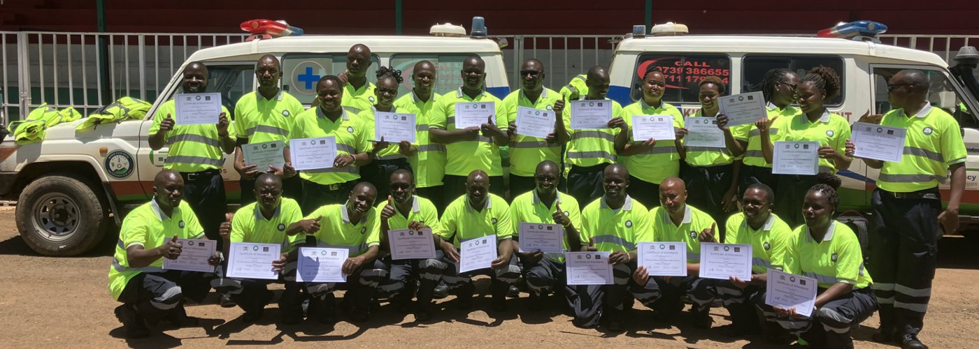 Graduates from the initial Kisii County Ambulance Service training programme holding their certificates.