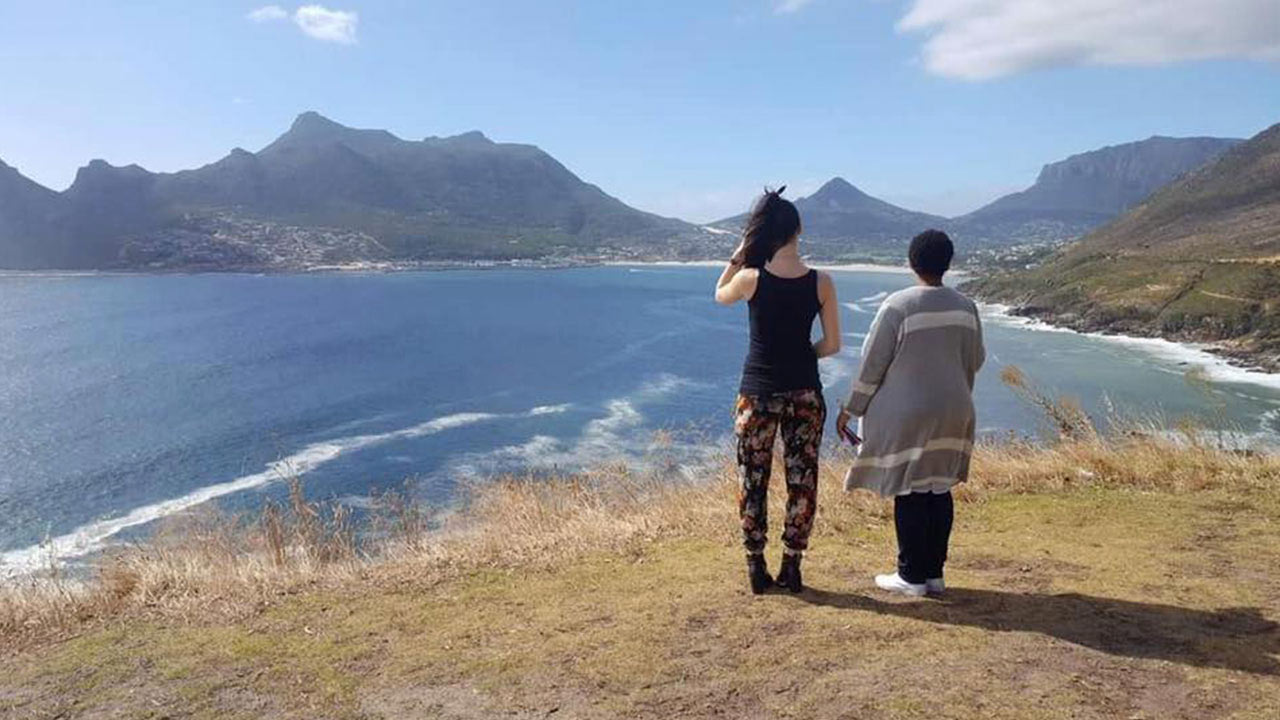 PhD students enjoying the sea view from Cape Town.