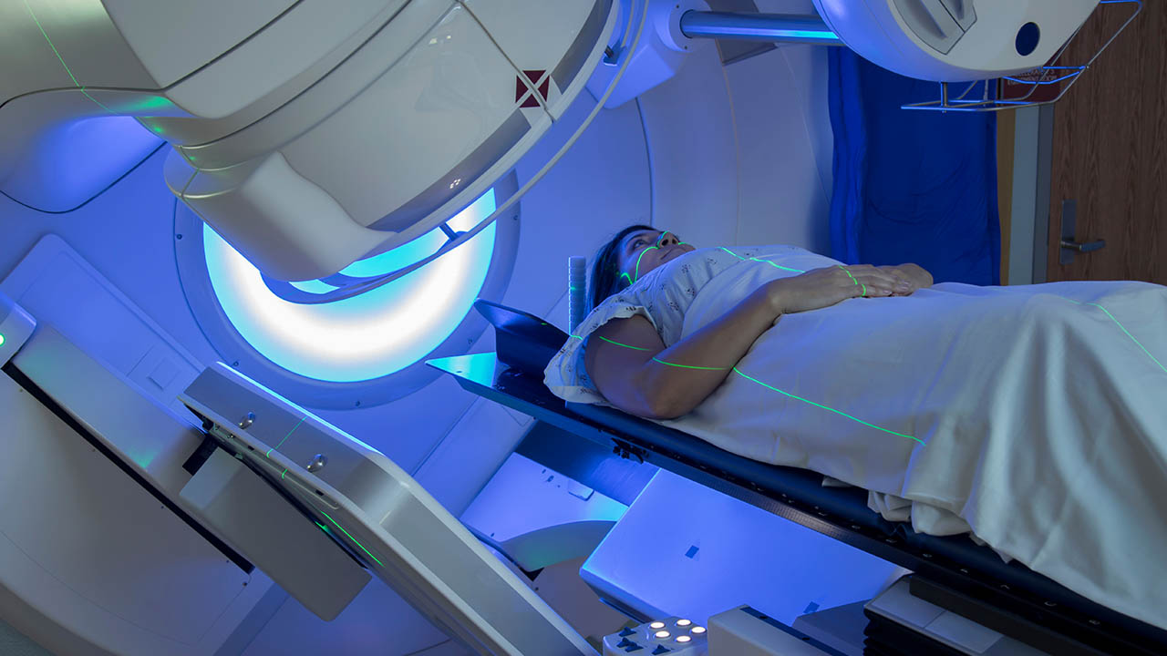 Woman receiving radiation therapy treatments for breast cancer