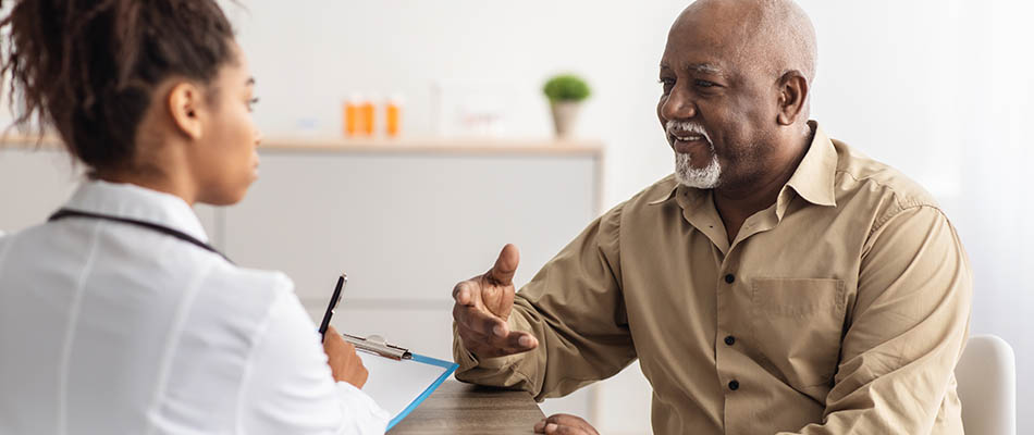 A person talking to a nurse during a medical appointment.