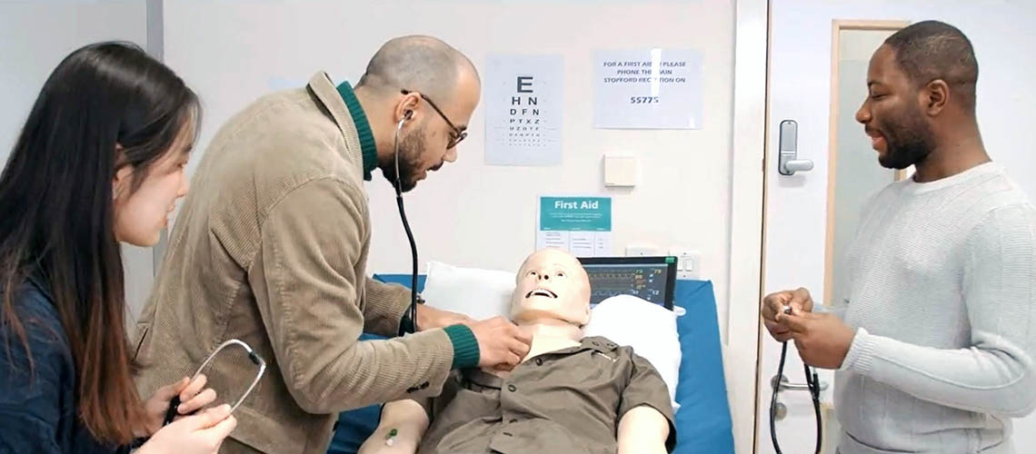 Manchester Pharmacy students learning clinical skills on a Sim man.