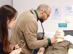 Manchester Pharmacy students learning clinical skills on a Sim man.