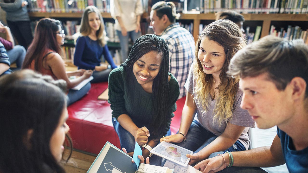 Group of students doing homework in the library