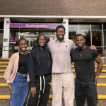 Four students on the steps of Stopford Building. From left to right: Elisha Goma Moukala, Farrah Adegunle, Carl Kulimushi, Meuke Cheta.