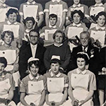 An old photo of nurses and other healthcare workers.