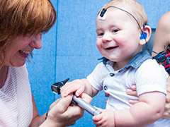 The University of Manchester researcher testing a children for hearing loss