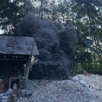 Plastic being burned in a village in Indonesia.