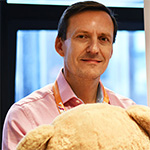 Roger Harrison with a teddy bear.