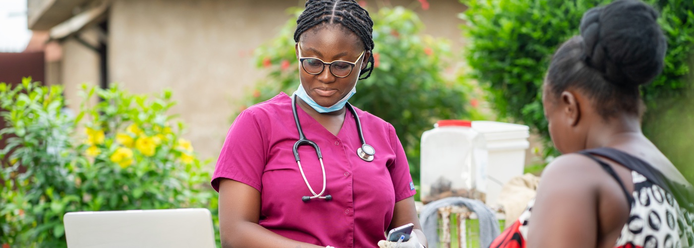 A healthcare worker with a patient.