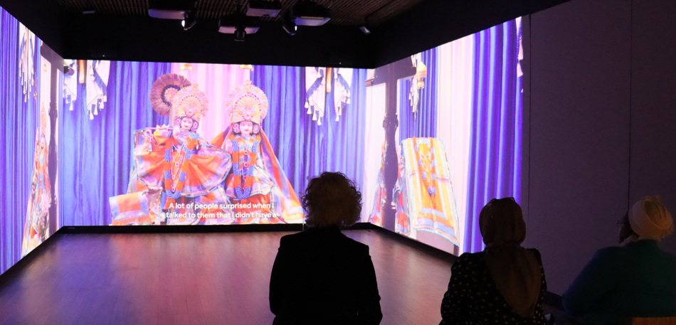 Suzanne Johnson, Binish Khatoon and Ncazelo Ncube watching a film featuring south Asian women.