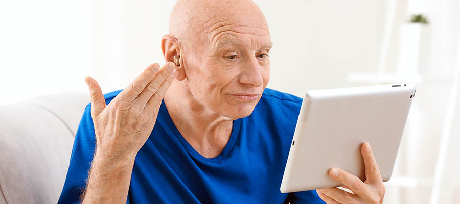 Programming a hearing aid via an online app.