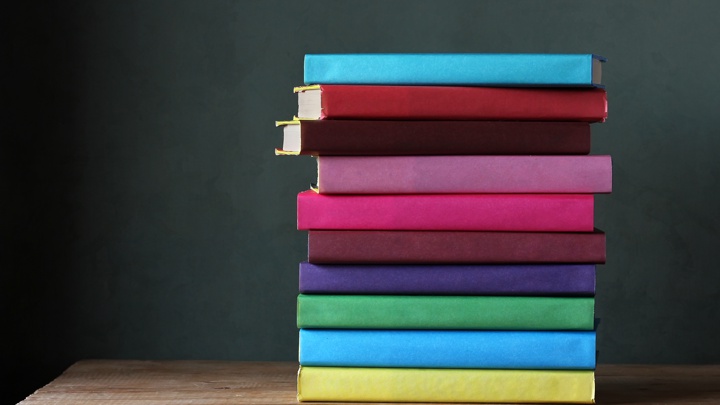 A pile of colourful books.
