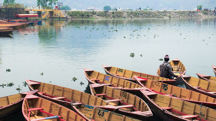 Fishing boats on the water in Nepal.