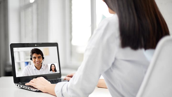 A person being interviewed via an online video call.