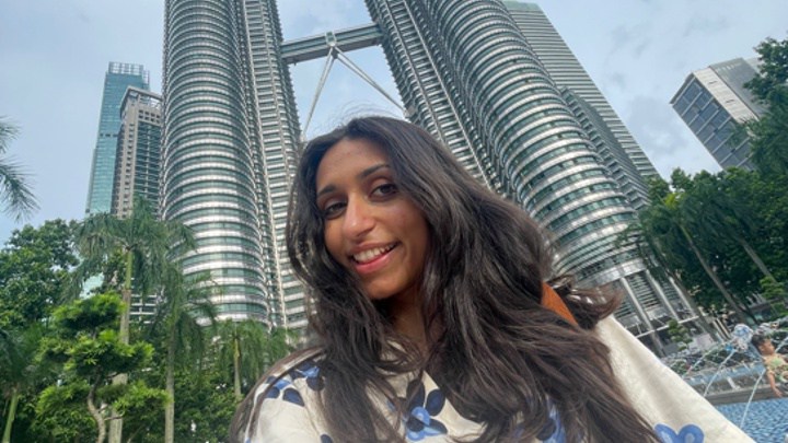 Noor in front of the Petronas Twin Towers in Kuala Lumpur.
