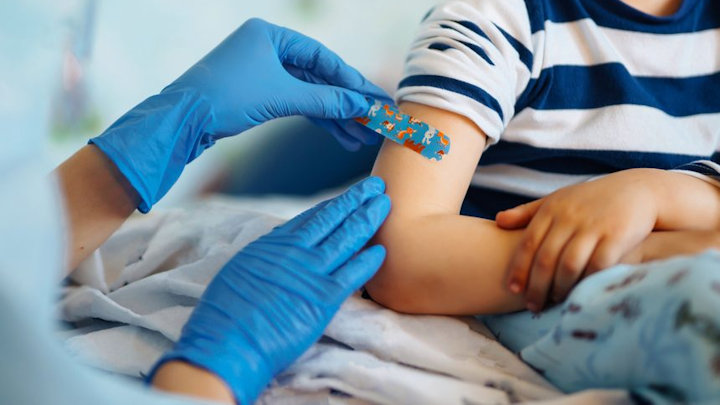 A photo of a nurse with a young patient.