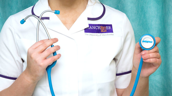 A photo of a student in a Manchester nursing uniform.