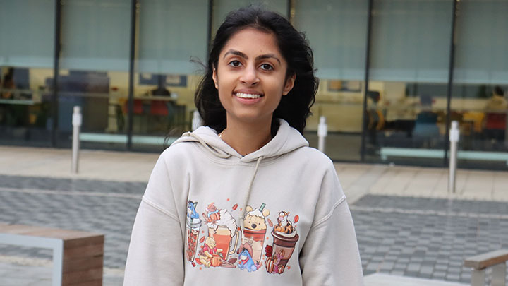 Priya Mistry outside a building on campus.