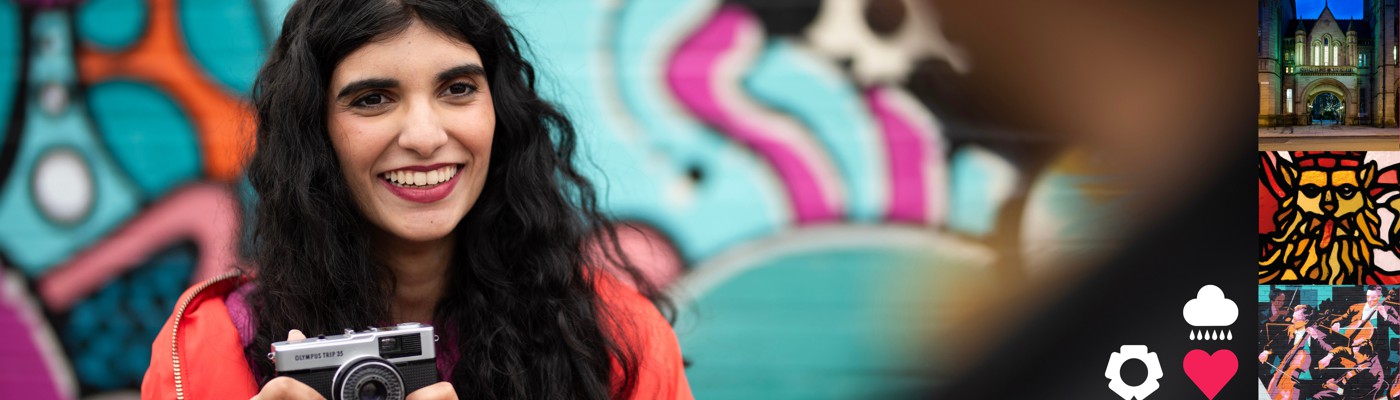 A student holding a camera.