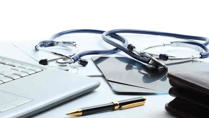 A stethoscope along with other office equipment.