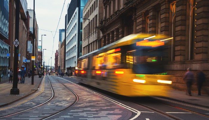 A tram travelling through Manchester