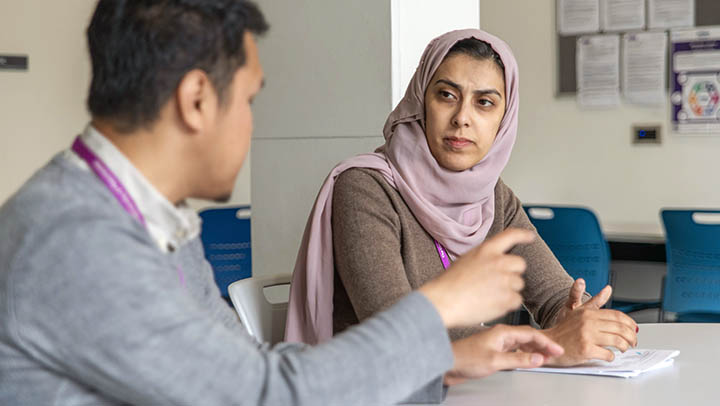 A postgraduate researcher meeting with her supervisor.