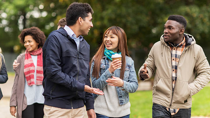 A group of students walking on campus.