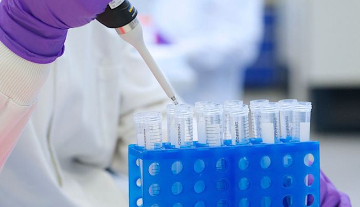 A researcher pipettes