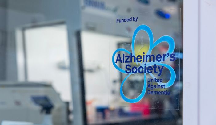 The Alzheimer's Society logo on a window