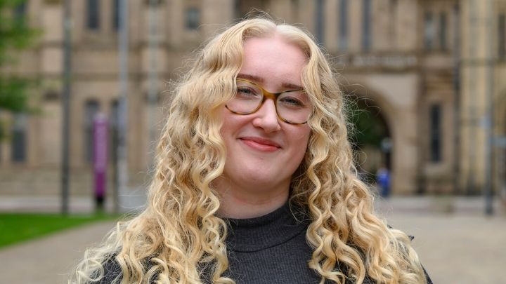 Holly smiling at camera in front of the Whitworth Arch