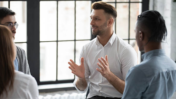 A discussion among a group of social workers.