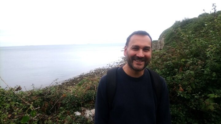 Dharman Jeyasingham, MA Social Work lecturer on a mountain